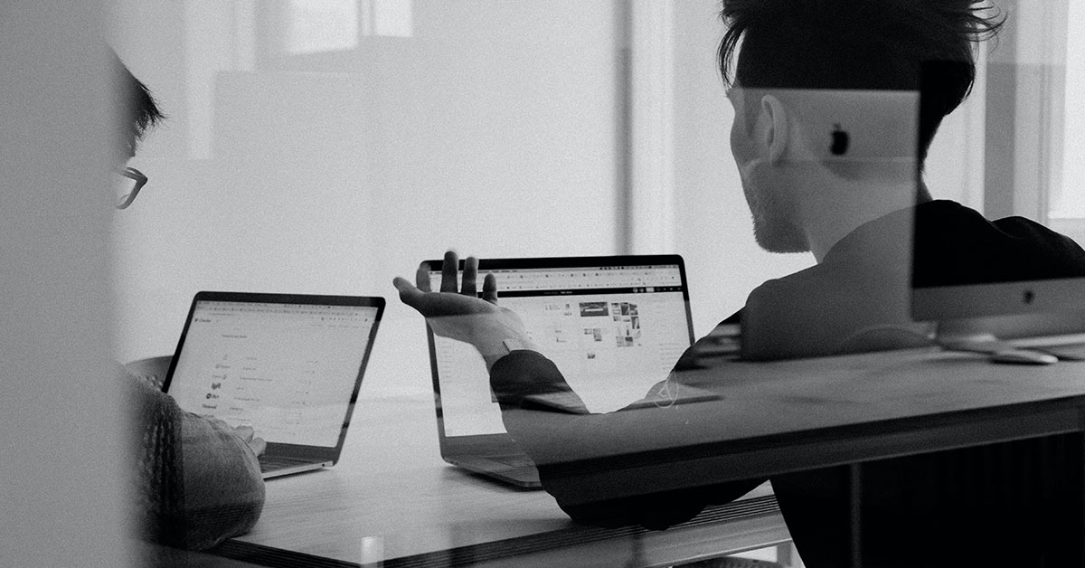 Men working computers building AI language models